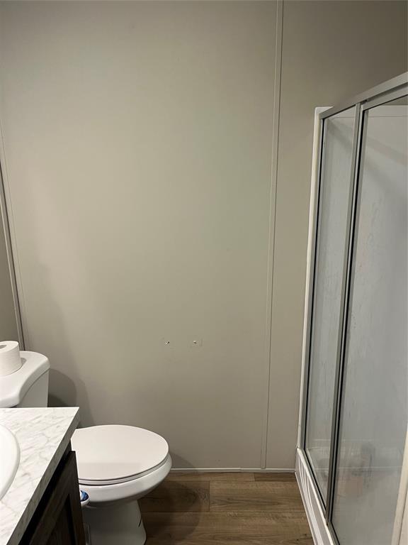 241 County Road 2168 Quitman, TX 75783 - Photo 9 of 11 a white toilet sitting next to a shower