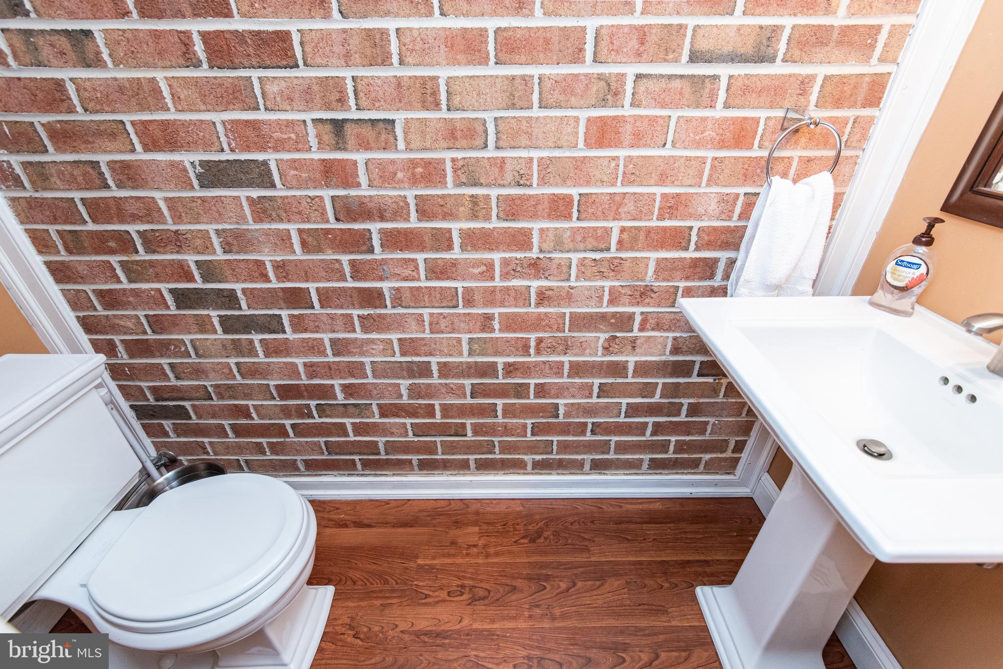 3850 Davis Corner Road Street, MD 21154 - Photo 4 of 57 Powder Room with Exposed Brick