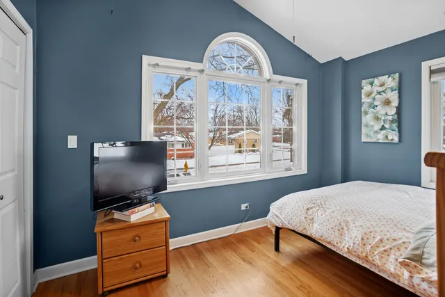 a bedroom with furniture and a window
