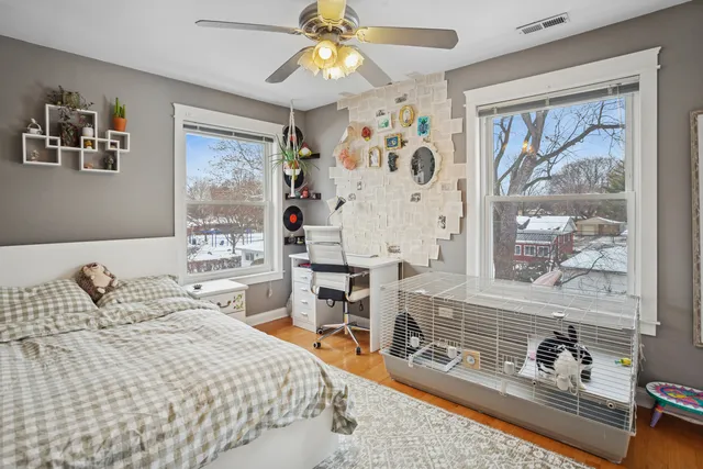 a bedroom with a bed and a window