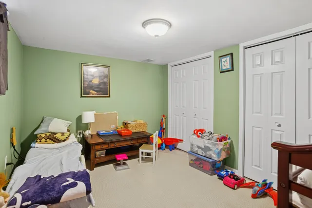 a play room with furniture and wooden floor