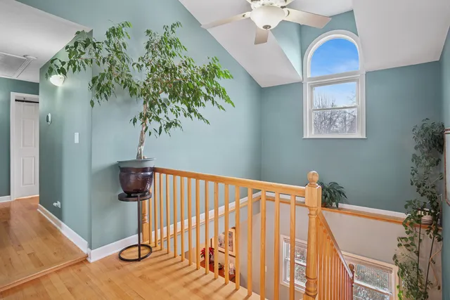 a view of a house with a yard covered in snow