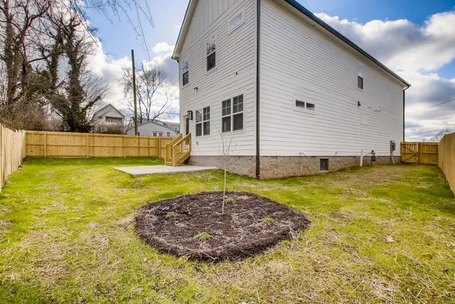a view of a swimming pool with a chair and floor to ceiling window