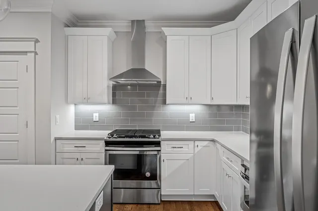 a kitchen with cabinets and appliances