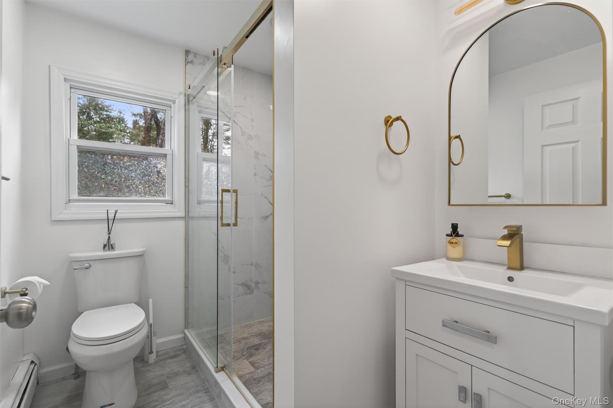 86 Beaver Brook Road Narrowsburg, NY 12764 - Photo 13 of 48 a bathroom with a sink a toilet and shower