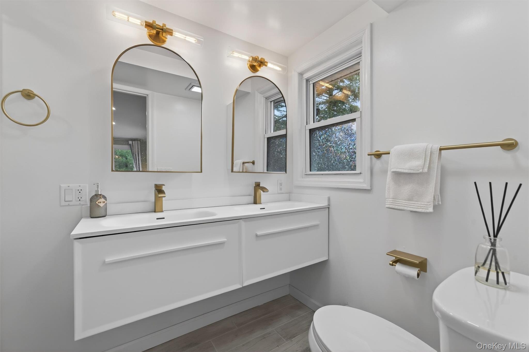 86 Beaver Brook Road Narrowsburg, NY 12764 - Photo 18 of 48 a bathroom with a toilet sink and mirror