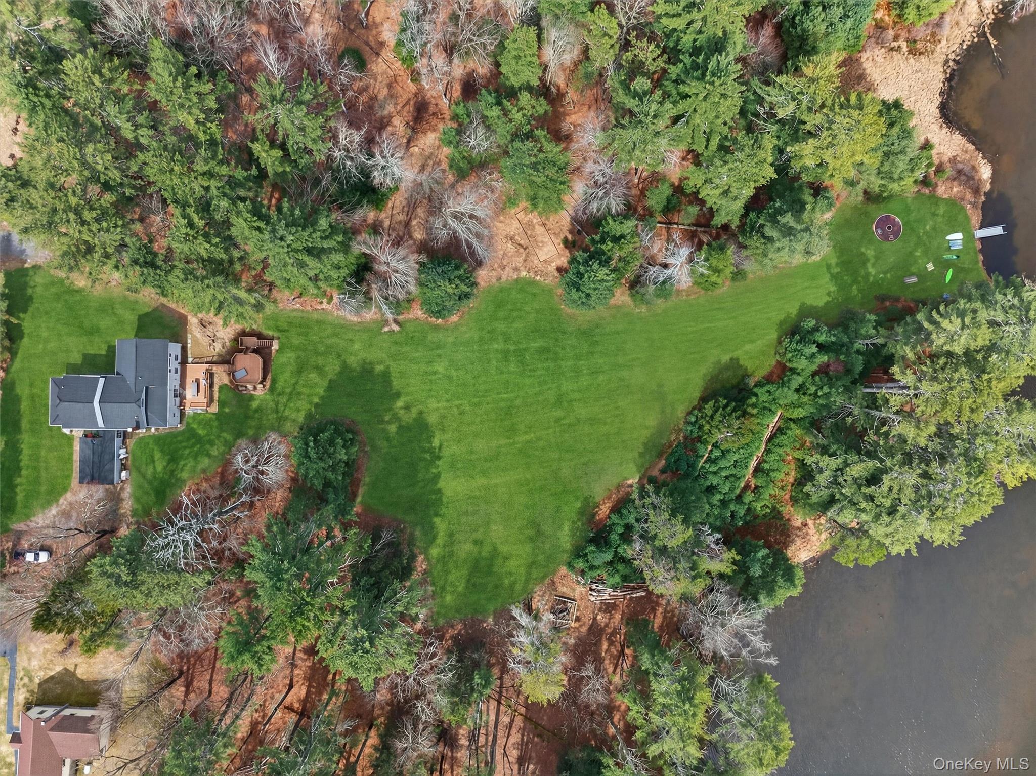 86 Beaver Brook Road Narrowsburg, NY 12764 - Photo 2 of 48 a view of a garden with a building in the background