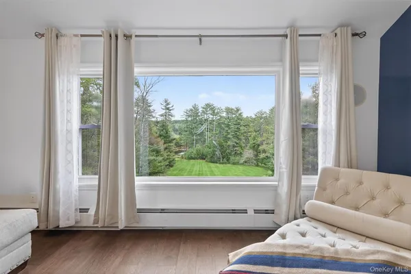 a view of a house with a deck and a yard