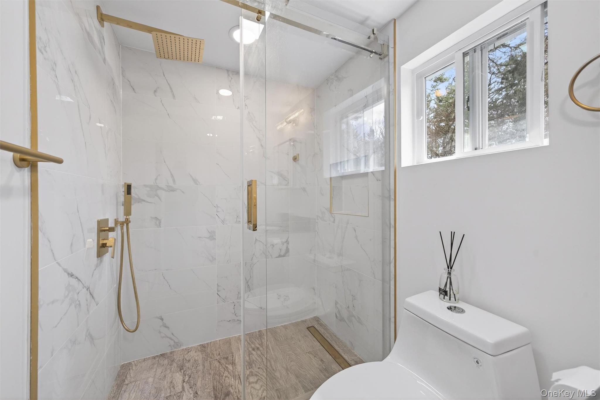 86 Beaver Brook Road Narrowsburg, NY 12764 - Photo 29 of 48 a bathroom with a toilet sink and shower