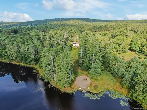 a view of a lake with a yard
