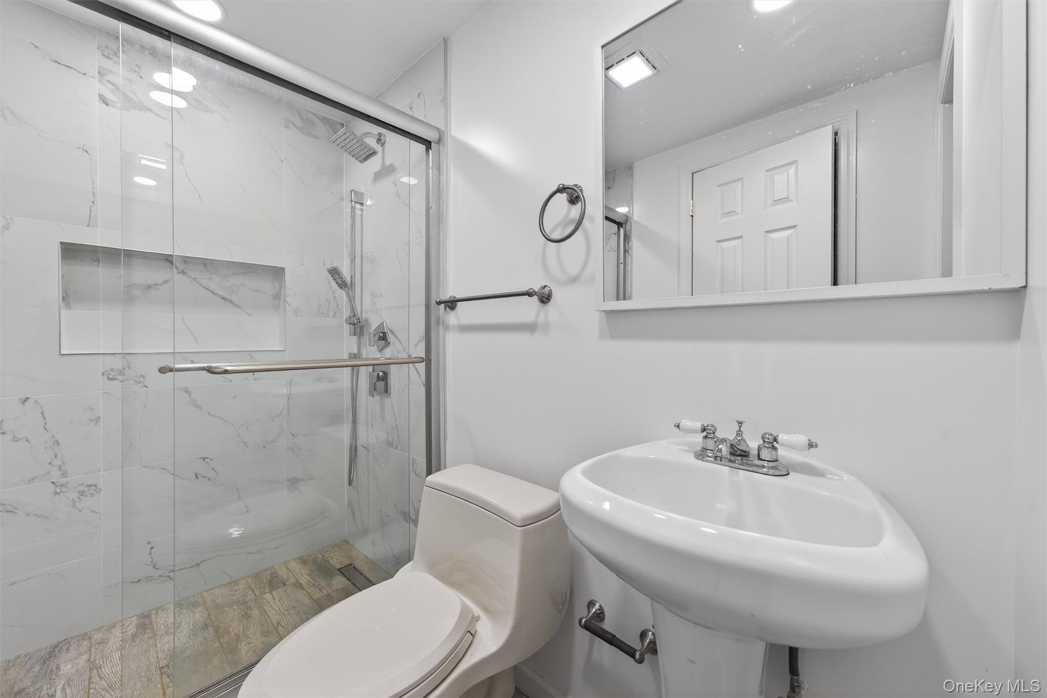 86 Beaver Brook Road Narrowsburg, NY 12764 - Photo 35 of 48 a bathroom with a sink toilet and shower