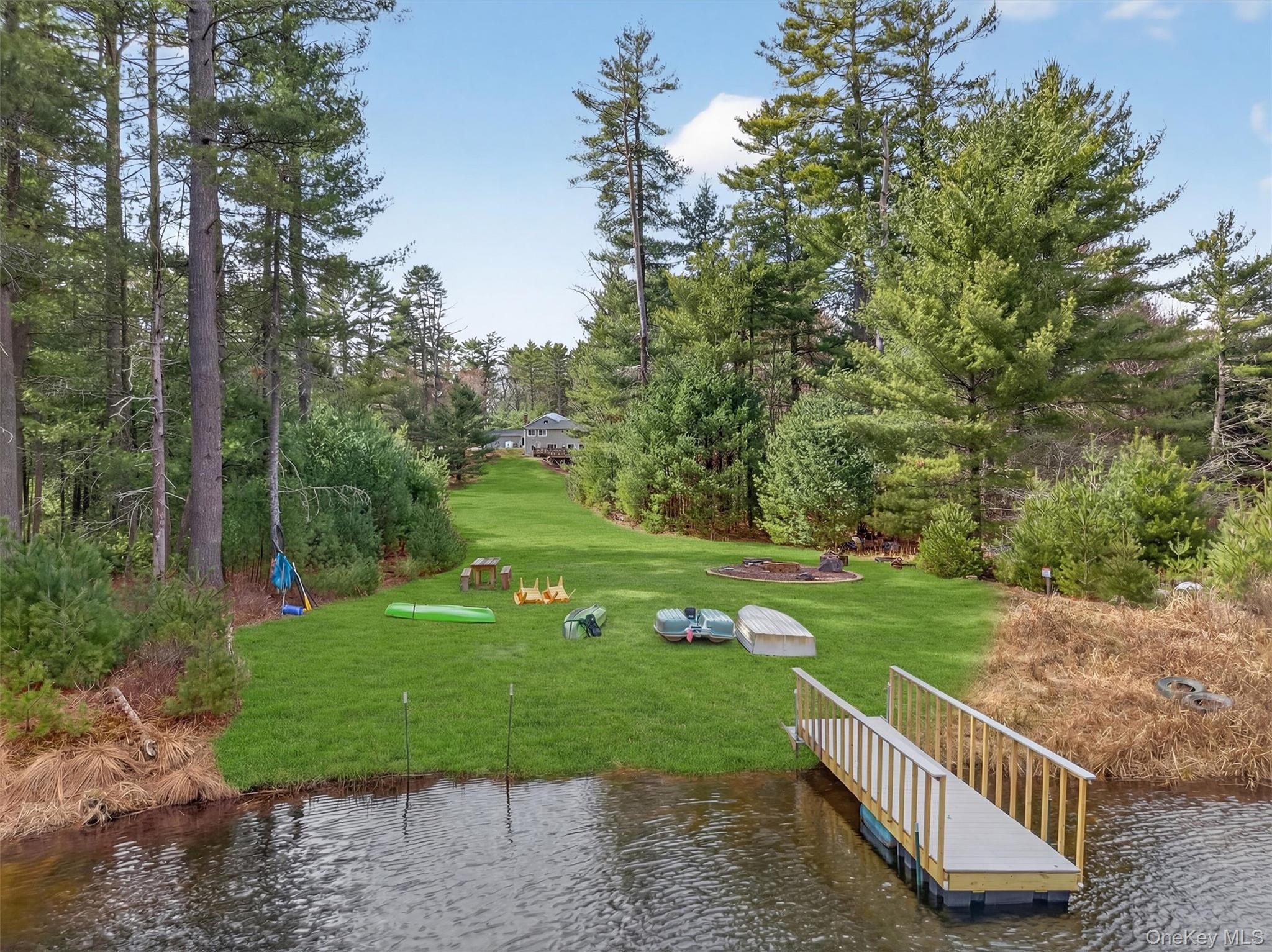 86 Beaver Brook Road Narrowsburg, NY 12764 - Photo 45 of 48 a view of a garden with plants and large trees