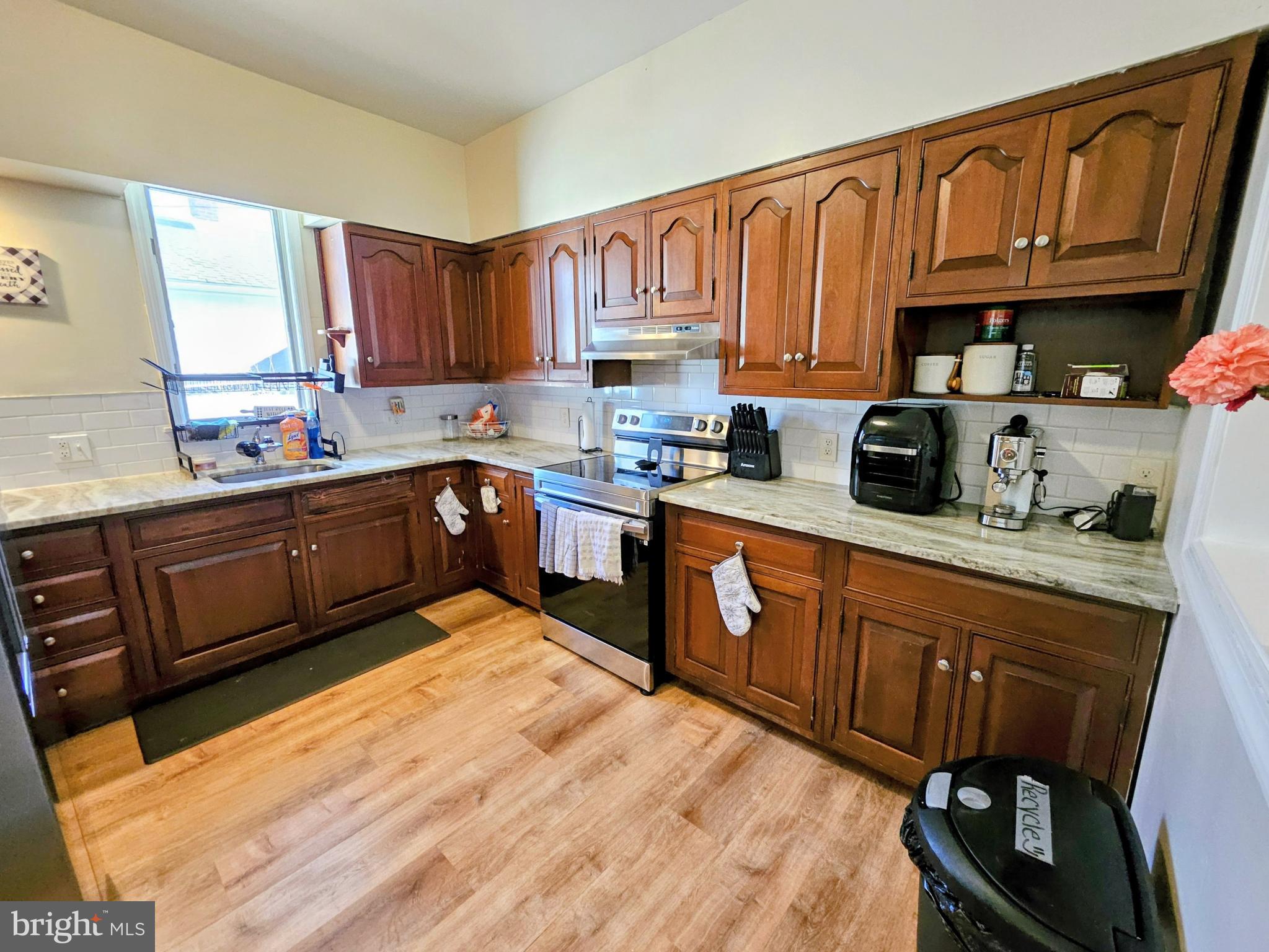 53 Jackson Road Penns Grove, NJ 08069 - Photo 11 of 24 a kitchen with stainless steel appliances granite countertop a sink dishwasher stove and cabinets