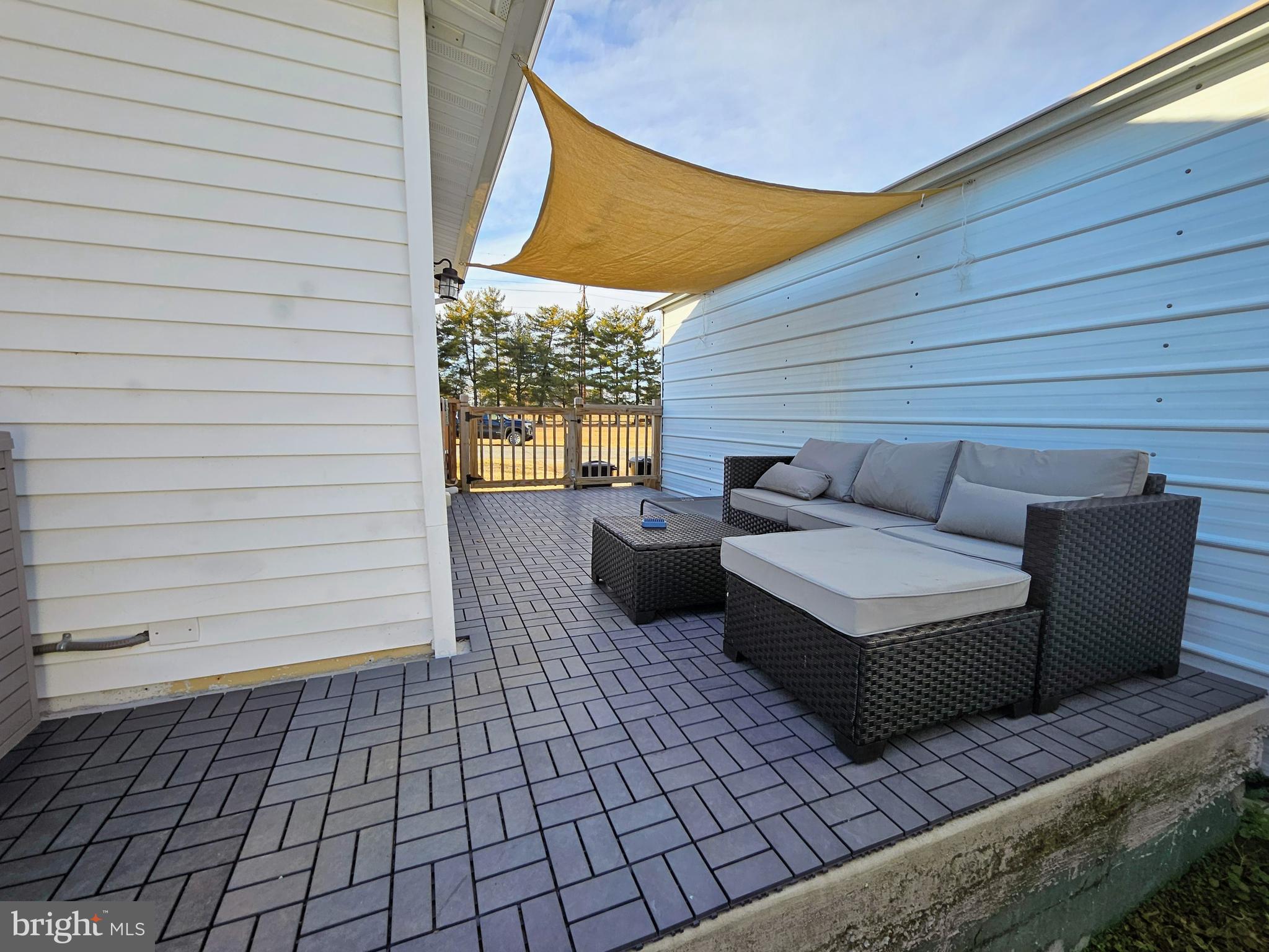 53 Jackson Road Penns Grove, NJ 08069 - Photo 20 of 24 a balcony with wooden floor and furniture