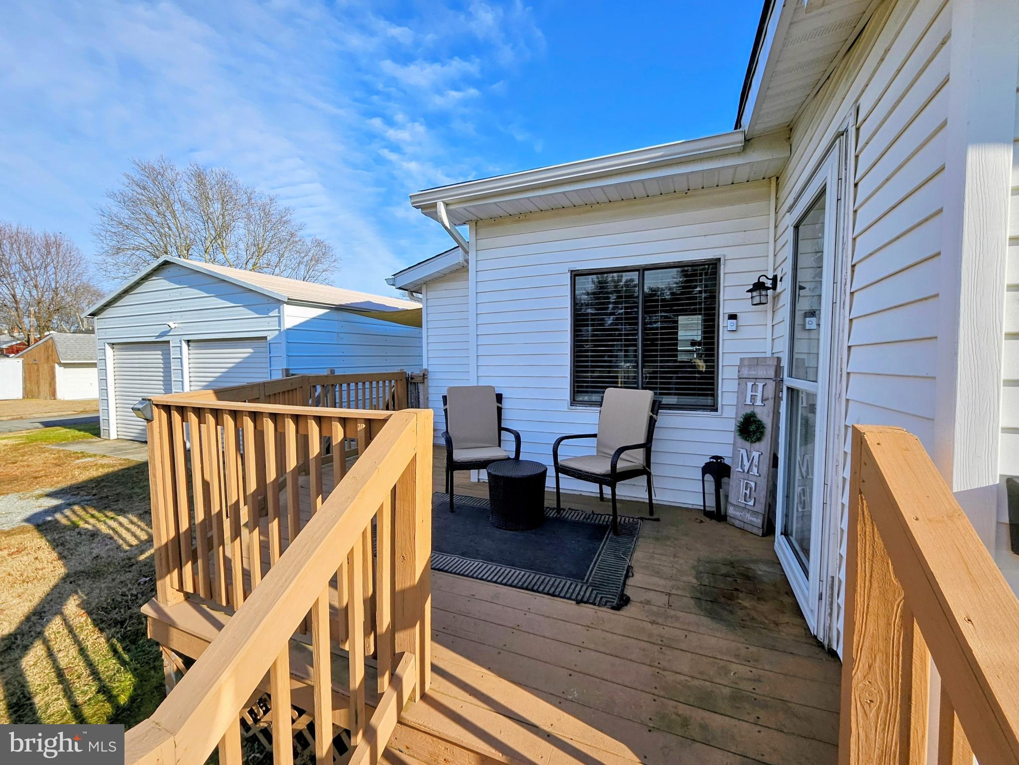 53 Jackson Road Penns Grove, NJ 08069 - Photo 7 of 24 a view of a patio with table and chairs with wooden floor and fence