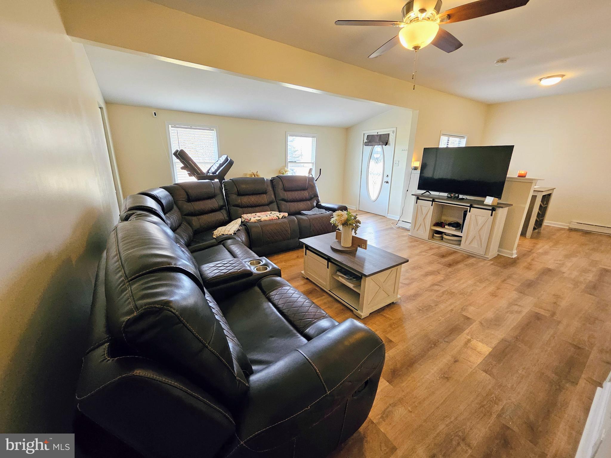 53 Jackson Road Penns Grove, NJ 08069 - Photo 8 of 24 a living room with furniture and a flat screen tv