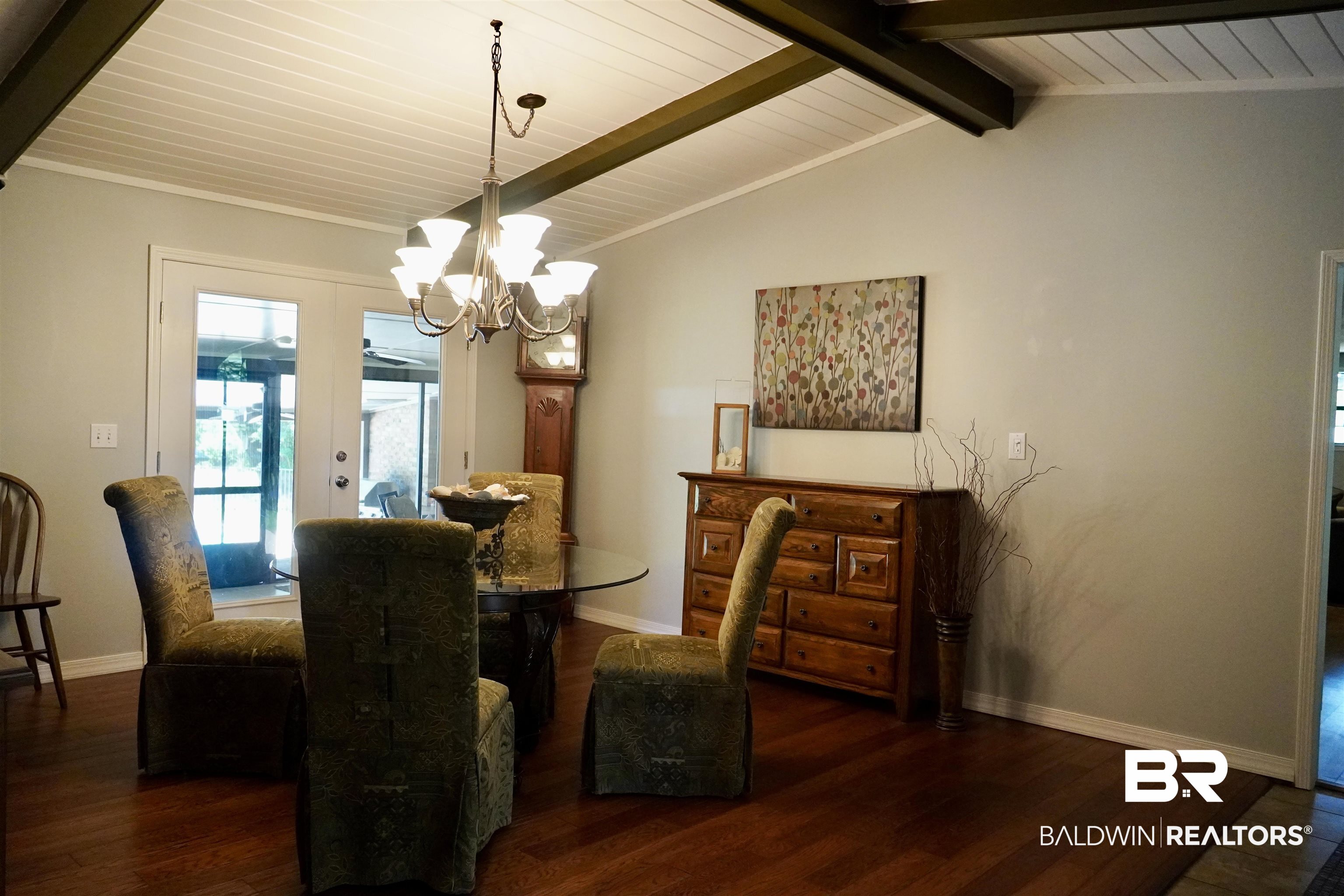 117 Belle Meade Brewton, AL 36426 - Photo 15 of 62 Dining space with a notable chandelier, lofted ceiling with beams, and dark wood-type flooring