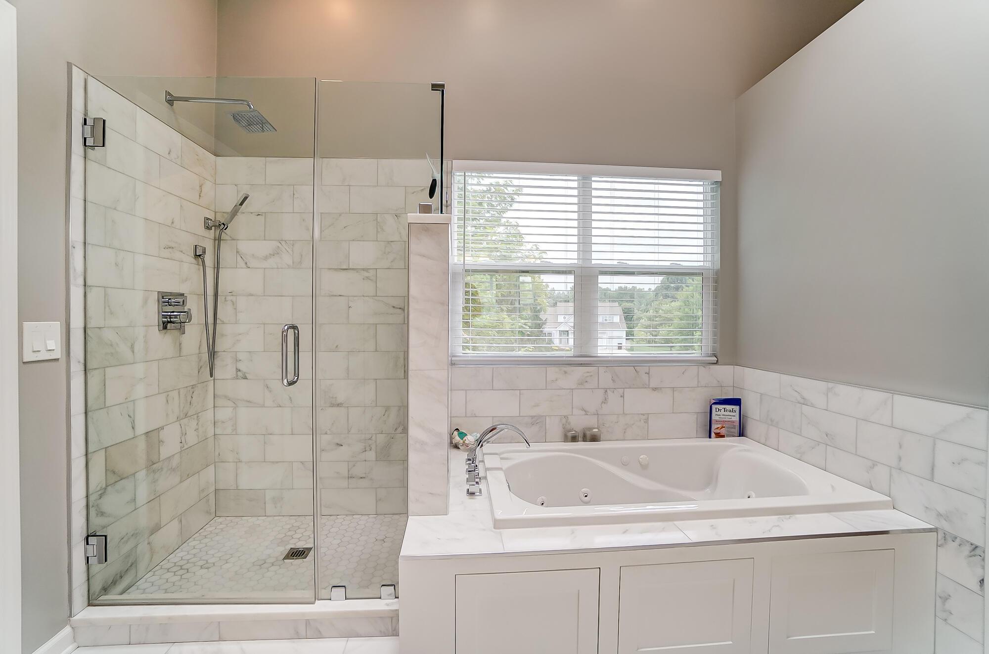 5674 Steward Road Galena, OH 43021 - Photo 53 of 82 New whirlpool tub, fixtures, tile, his/her niches in shower, seamless shower door