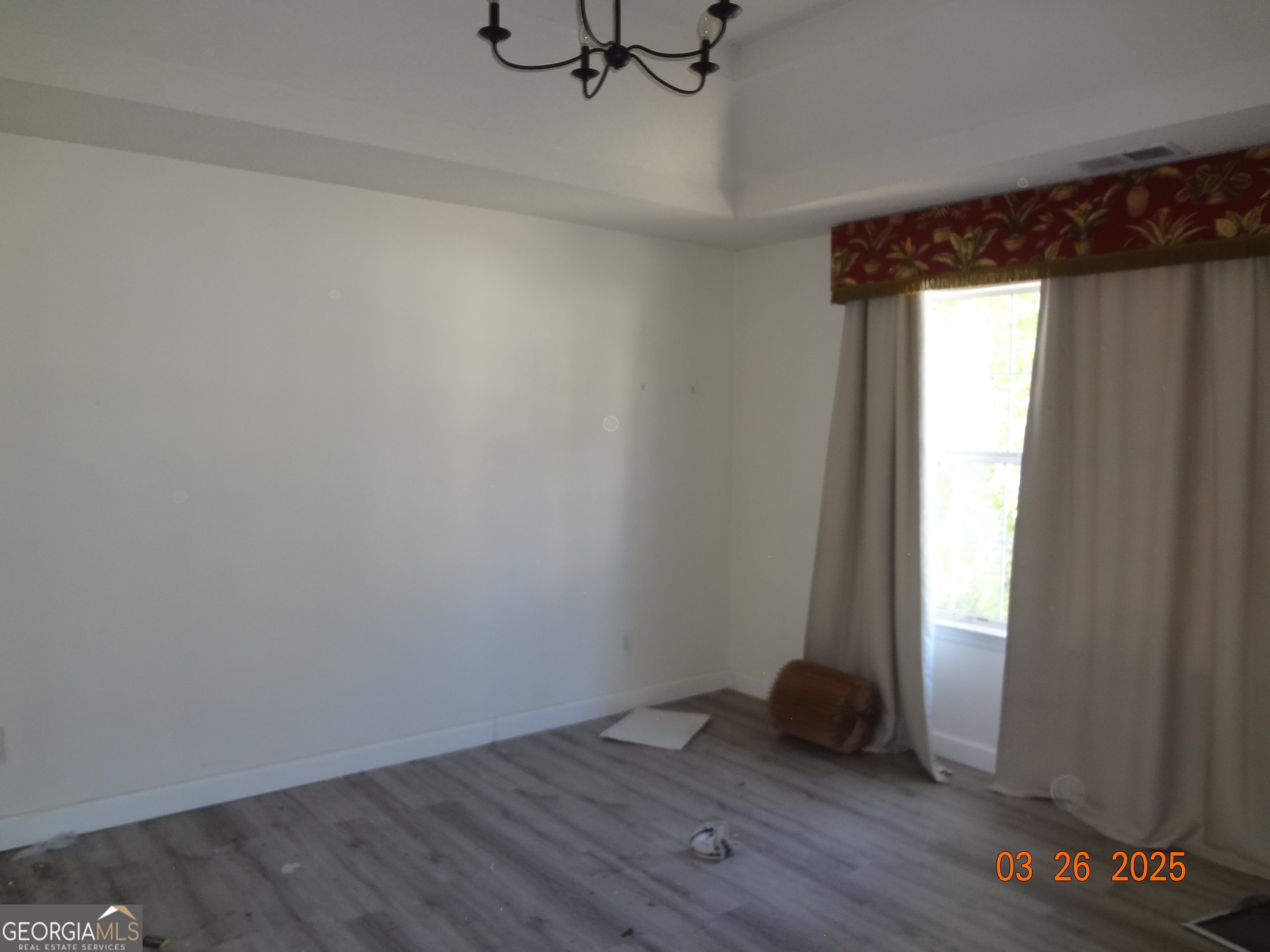 2338 Rambling Way Lithonia, GA 30058 - Photo 12 of 16 an empty room with wooden floor and windows