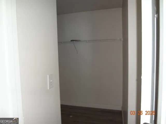 a bathroom with a granite countertop sink and a vanity