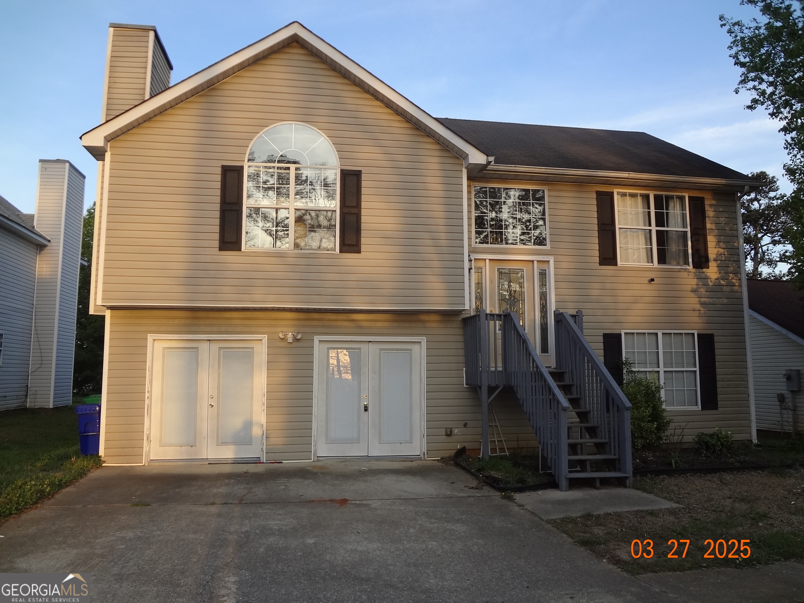 2338 Rambling Way Lithonia, GA 30058 - Photo 2 of 16 a front view of a house with a garage