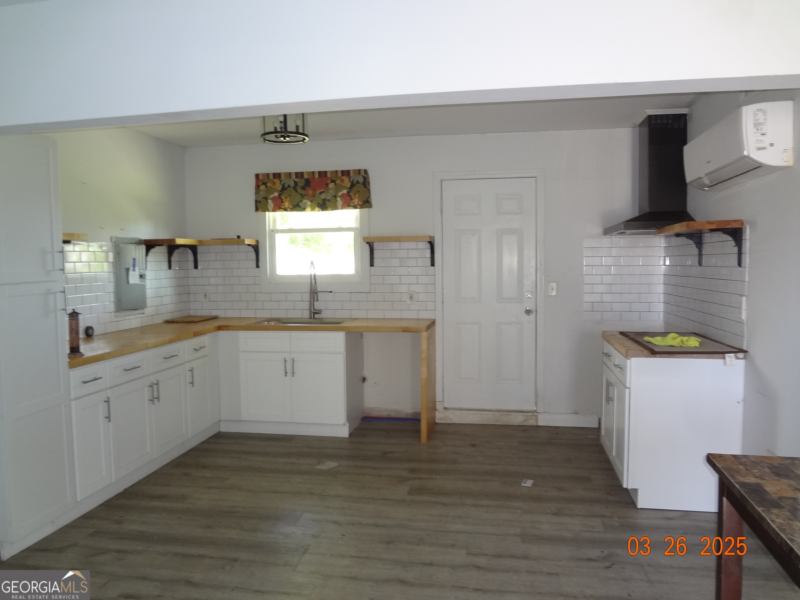 2338 Rambling Way Lithonia, GA 30058 - Photo 4 of 16 a kitchen with a sink cabinets and wooden floor