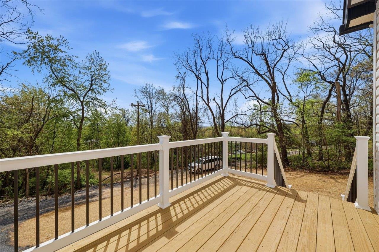 103 Hilltop Terrace Road Staunton, VA 24401 - Photo 37 of 47 a view of a balcony with wooden floor and fence