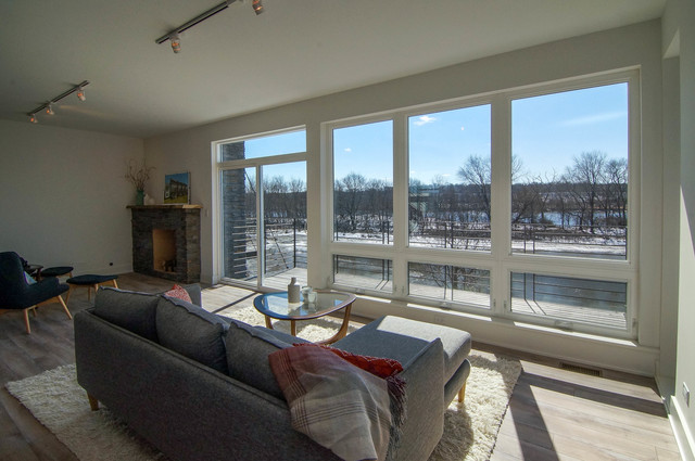43 Windward Way Ottawa, IL 61350 - Photo 7 of 25 a living room with furniture and a floor to ceiling window