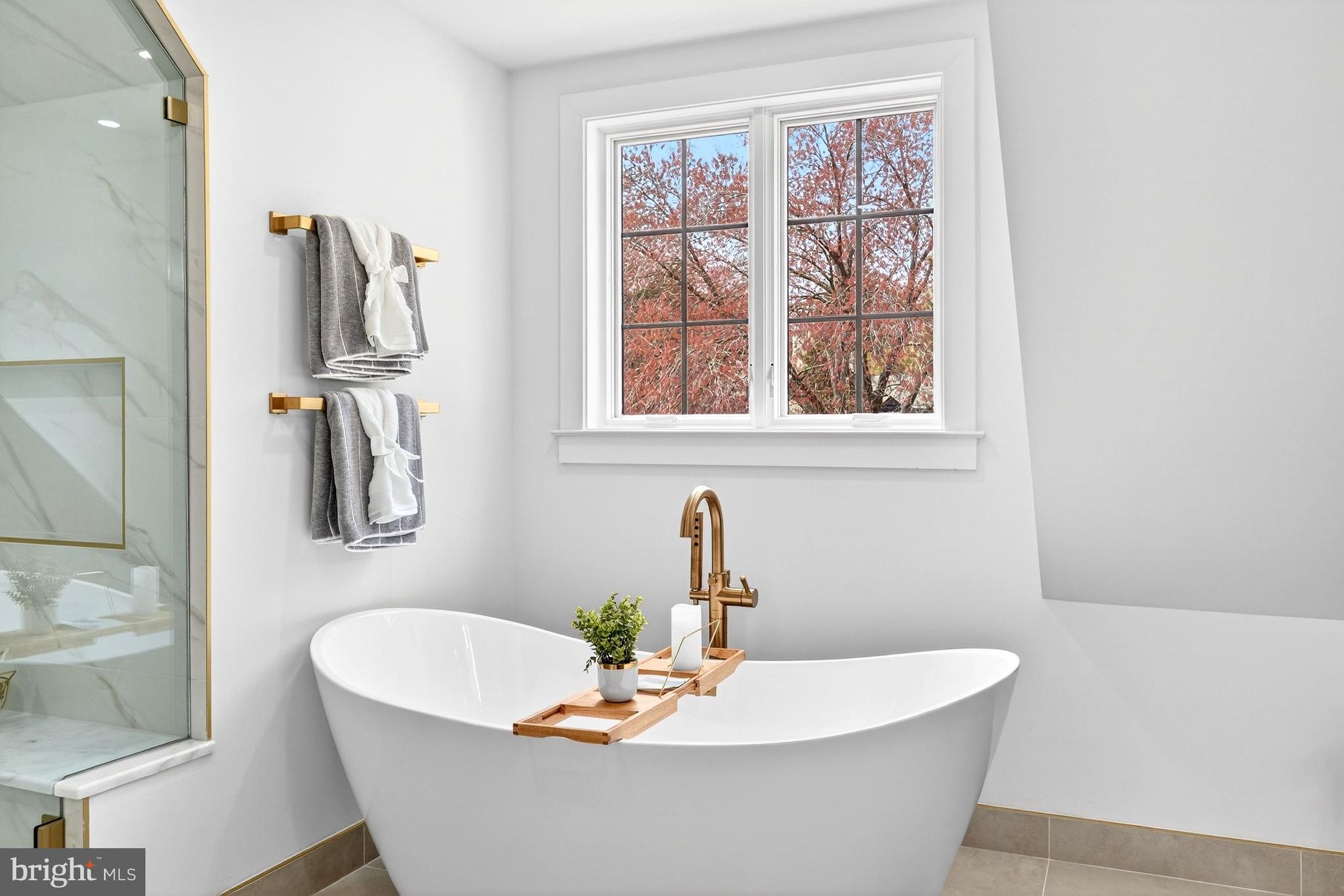 7126 Darby Road Bethesda, MD 20817 - Photo 45 of 84 a white bath tub sitting next to a window