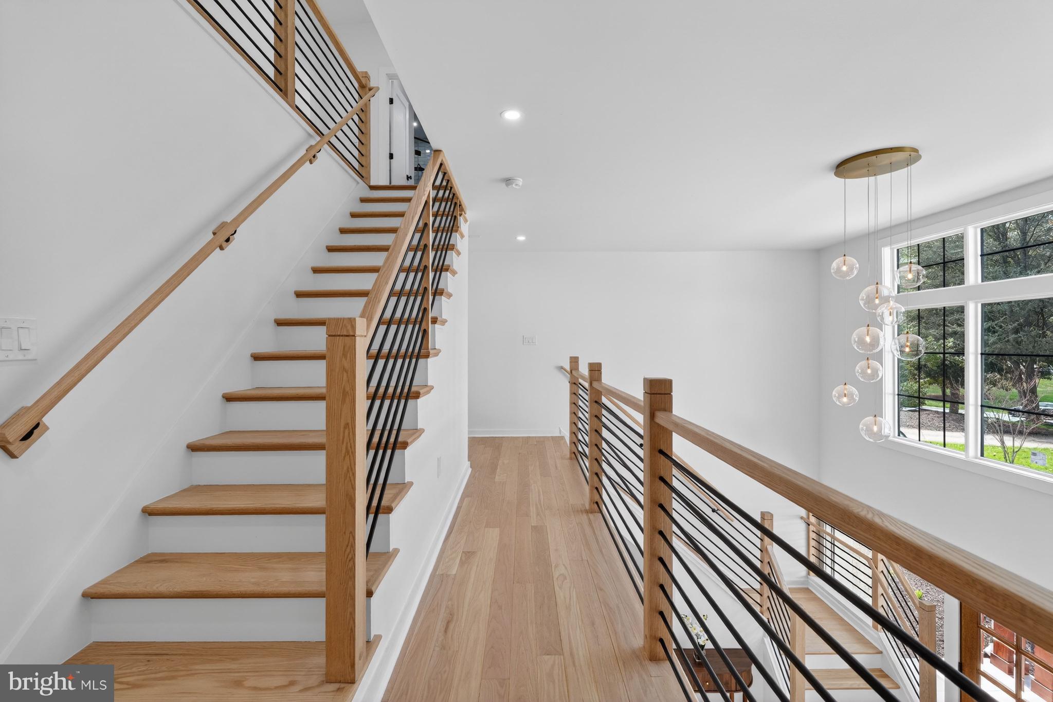 7126 Darby Road Bethesda, MD 20817 - Photo 53 of 84 a view of a room with wooden floor and stairs