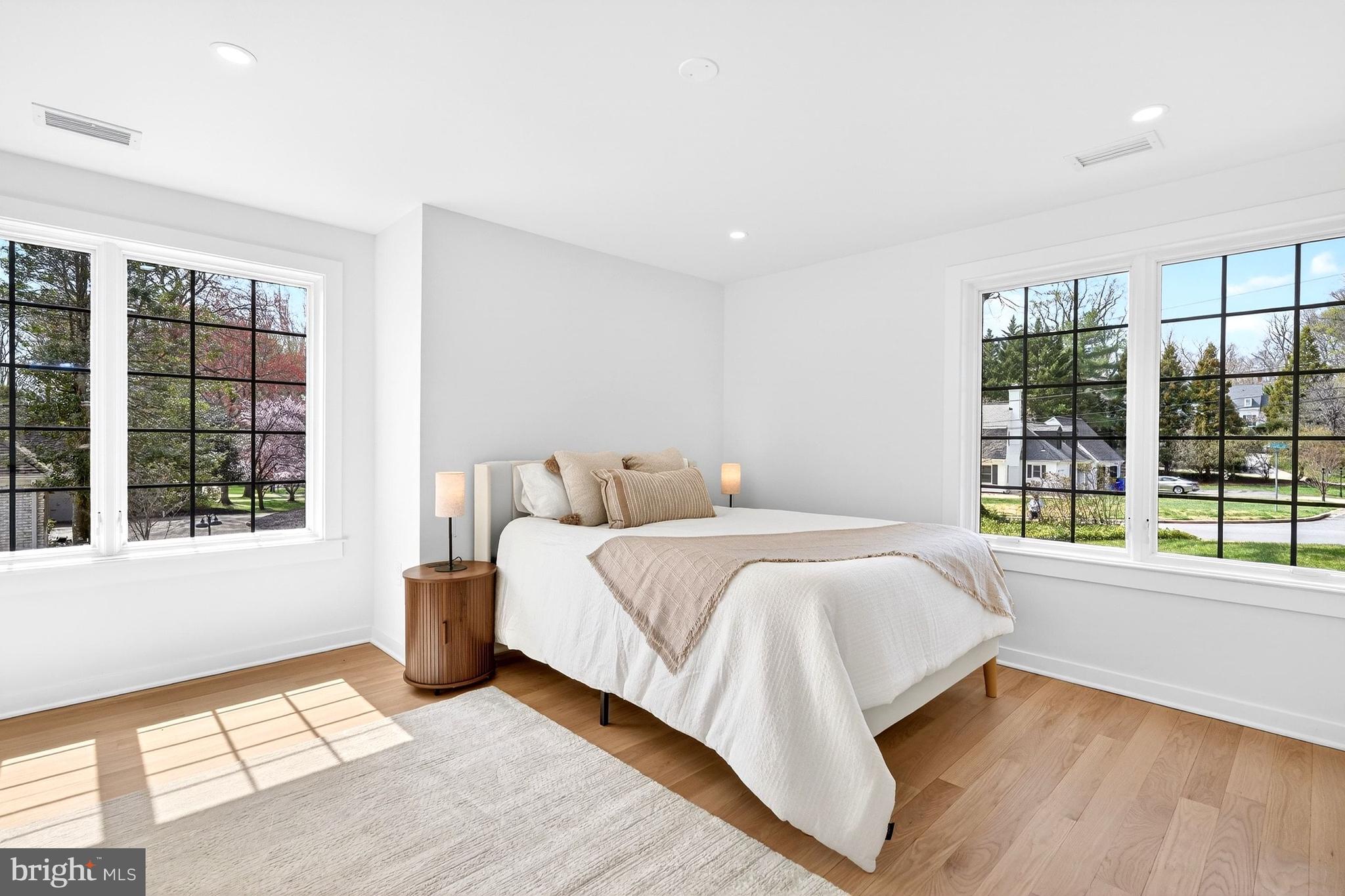 7126 Darby Road Bethesda, MD 20817 - Photo 63 of 84 a spacious bedroom with a bed and a large window