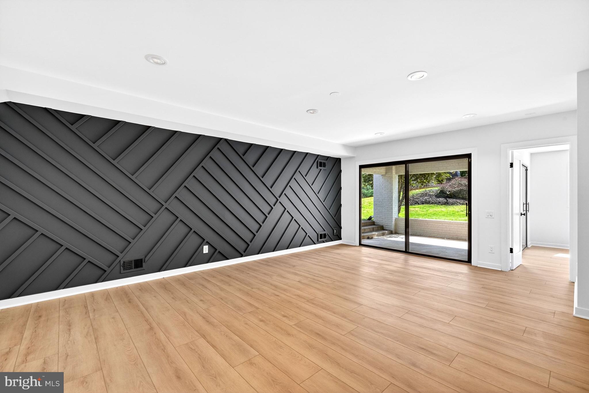 7126 Darby Road Bethesda, MD 20817 - Photo 65 of 84 a view of an empty room with wooden floor and a window