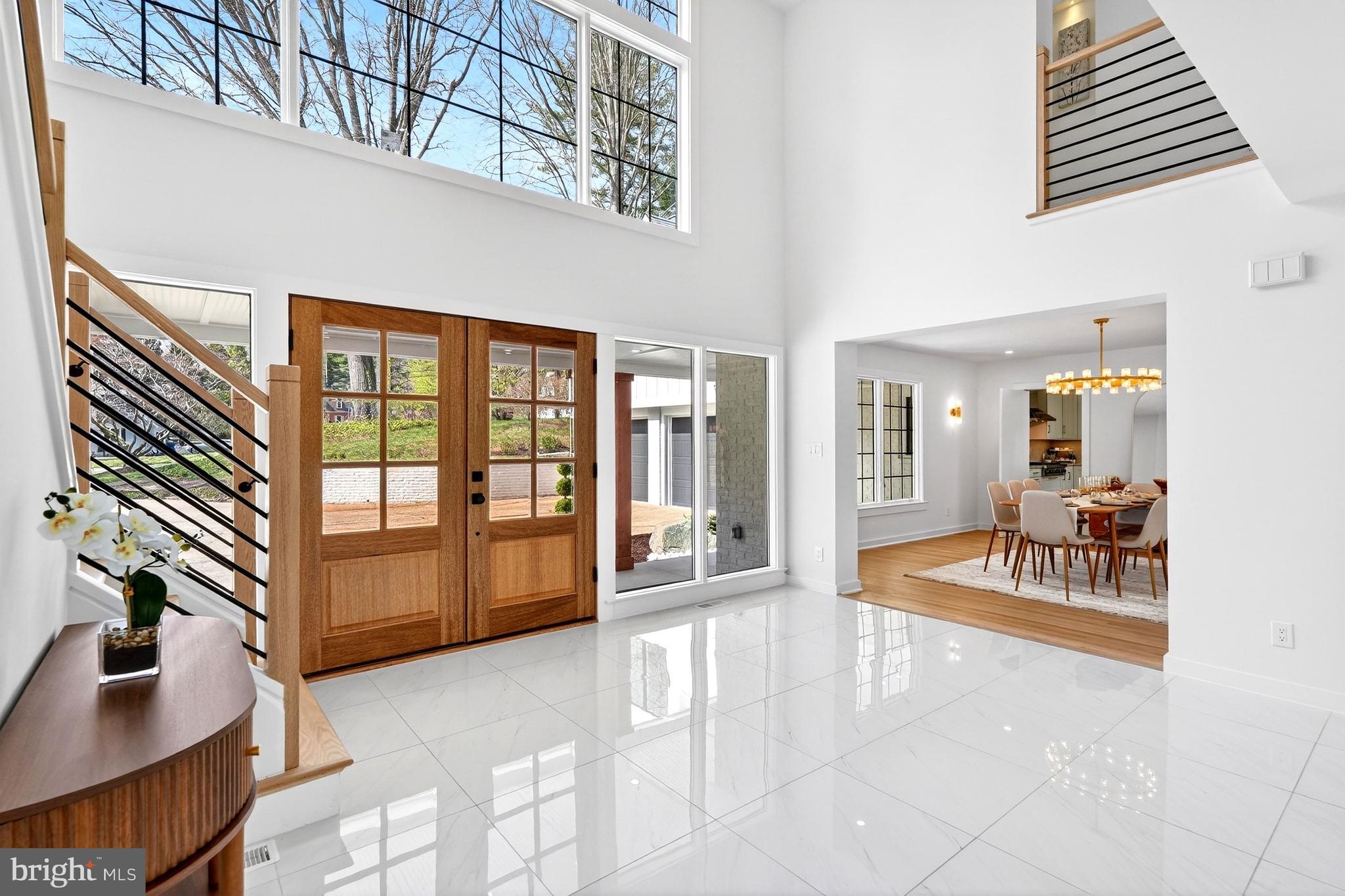 7126 Darby Road Bethesda, MD 20817 - Photo 9 of 84 a view of a livingroom with furniture and floor to ceiling window