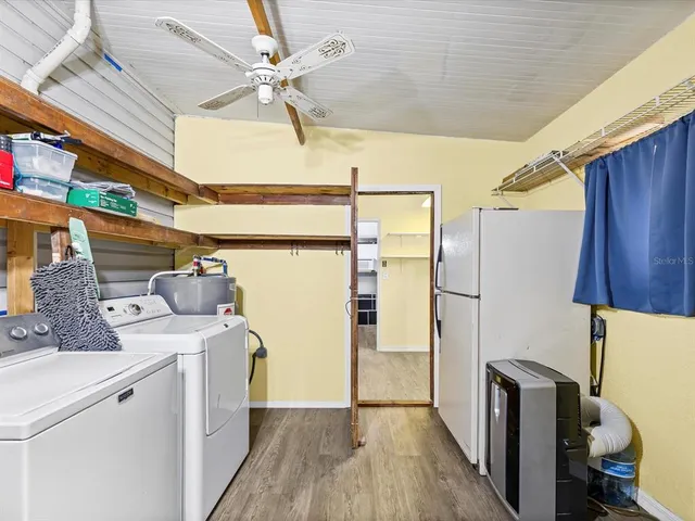 a view of a room with wooden floor