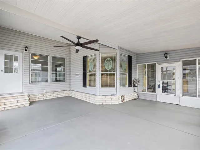 a view of a swimming pool with sitting area