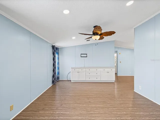 a view of a hallway with chandelier