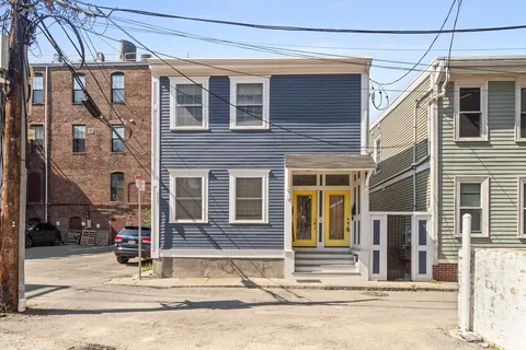 a view of a house with a street