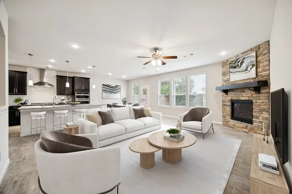 a living room with furniture and a fireplace