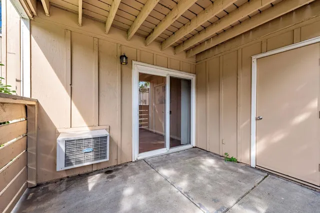 a view of livingroom with an empty space and wooden floor