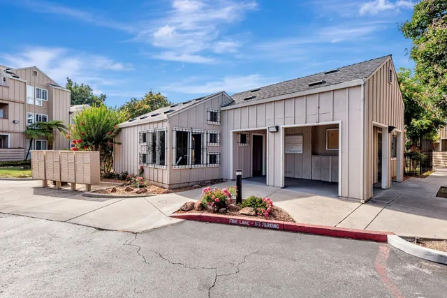 a view of house with outdoor space and sitting area