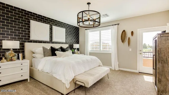 a bedroom with bed and a window