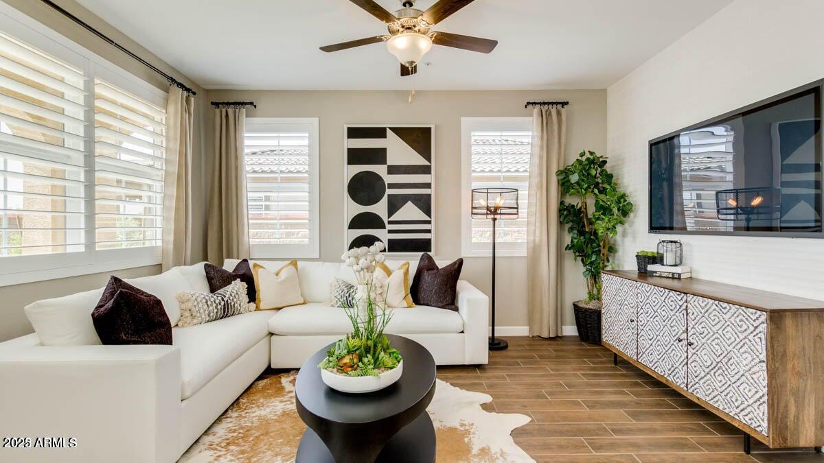 1255 North Arizona Avenue, Unit 1314 Chandler, AZ 85225 - Photo 2 of 23 a living room with furniture and wooden floor