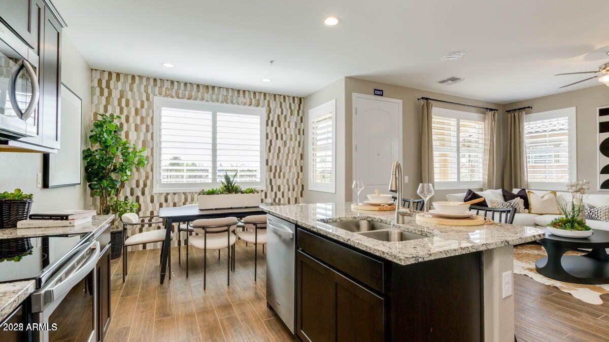 1255 North Arizona Avenue, Unit 1314 Chandler, AZ 85225 - Photo 5 of 23 a kitchen with sink and view of living room