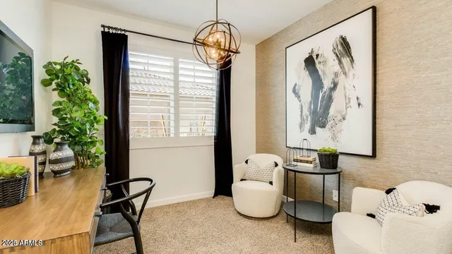 a living room with furniture and potted plant