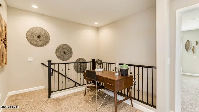 a view of a hallway with seating area