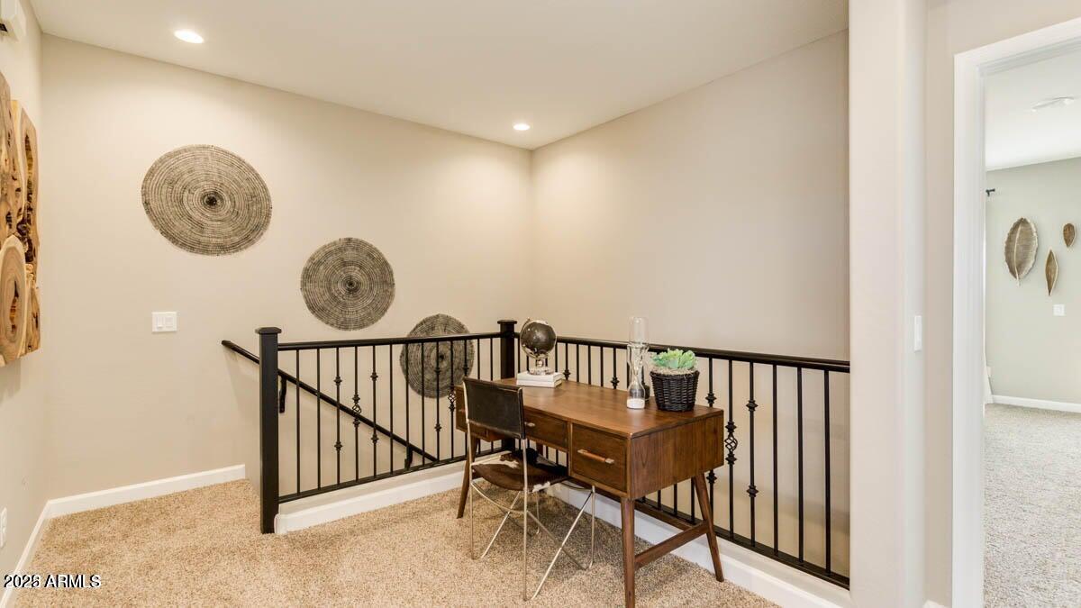1255 North Arizona Avenue, Unit 1314 Chandler, AZ 85225 - Photo 9 of 23 a view of a hallway with seating area