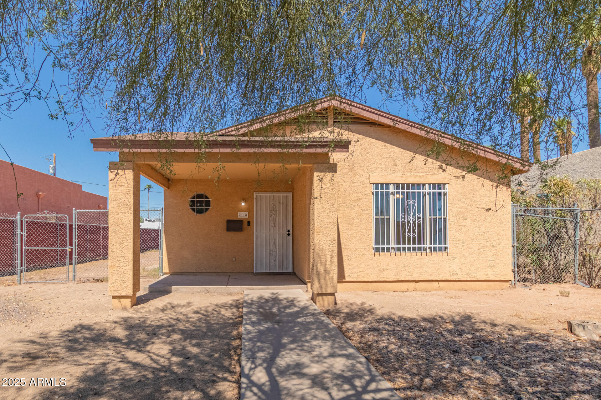 2118 West Adams Street Phoenix, AZ 85009 - Photo 1 of 48 a view of a house with a yard