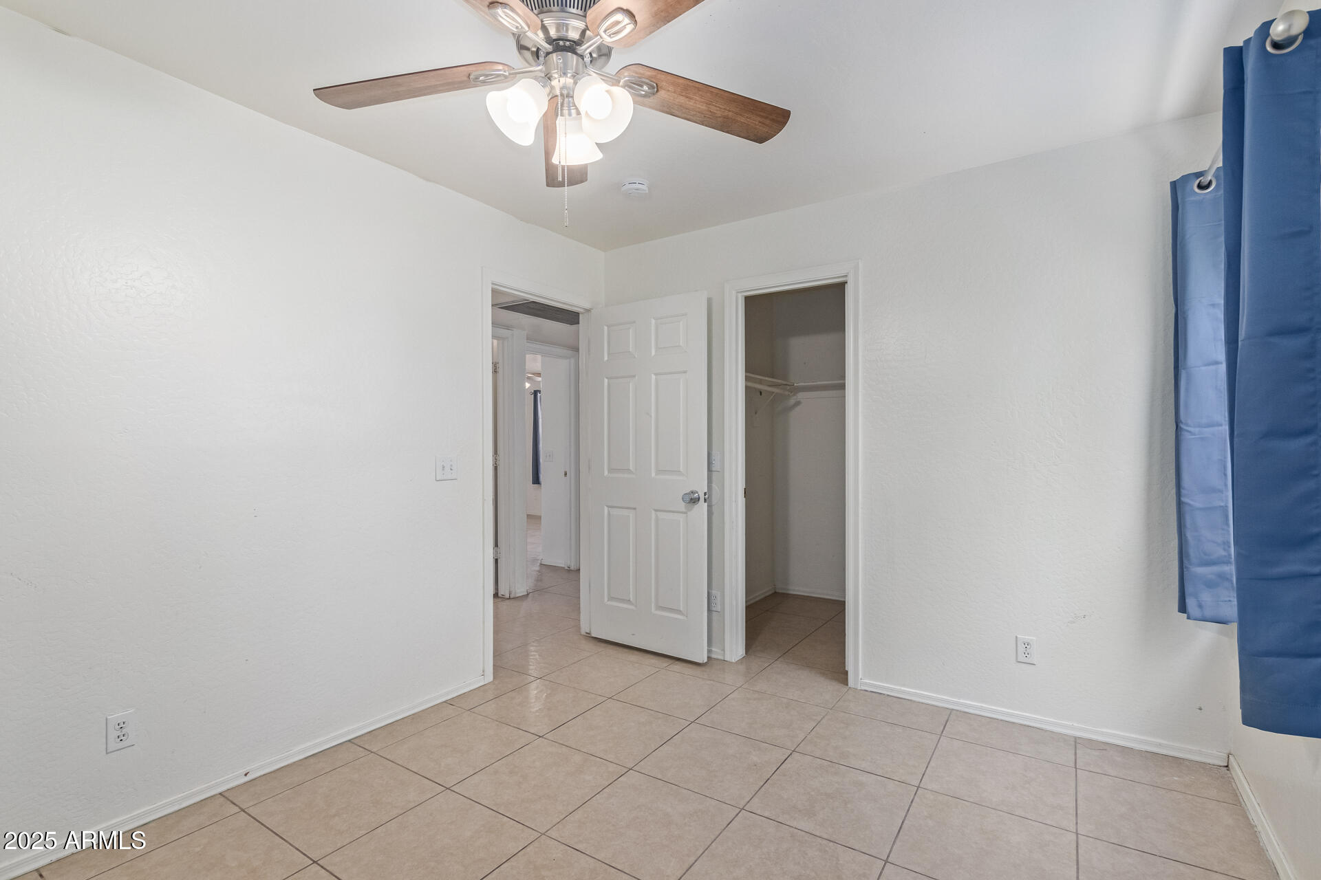 2118 West Adams Street Phoenix, AZ 85009 - Photo 16 of 48 a view of an empty room and chandelier fan