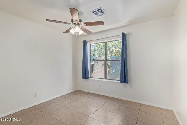 an empty room with a bathroom
