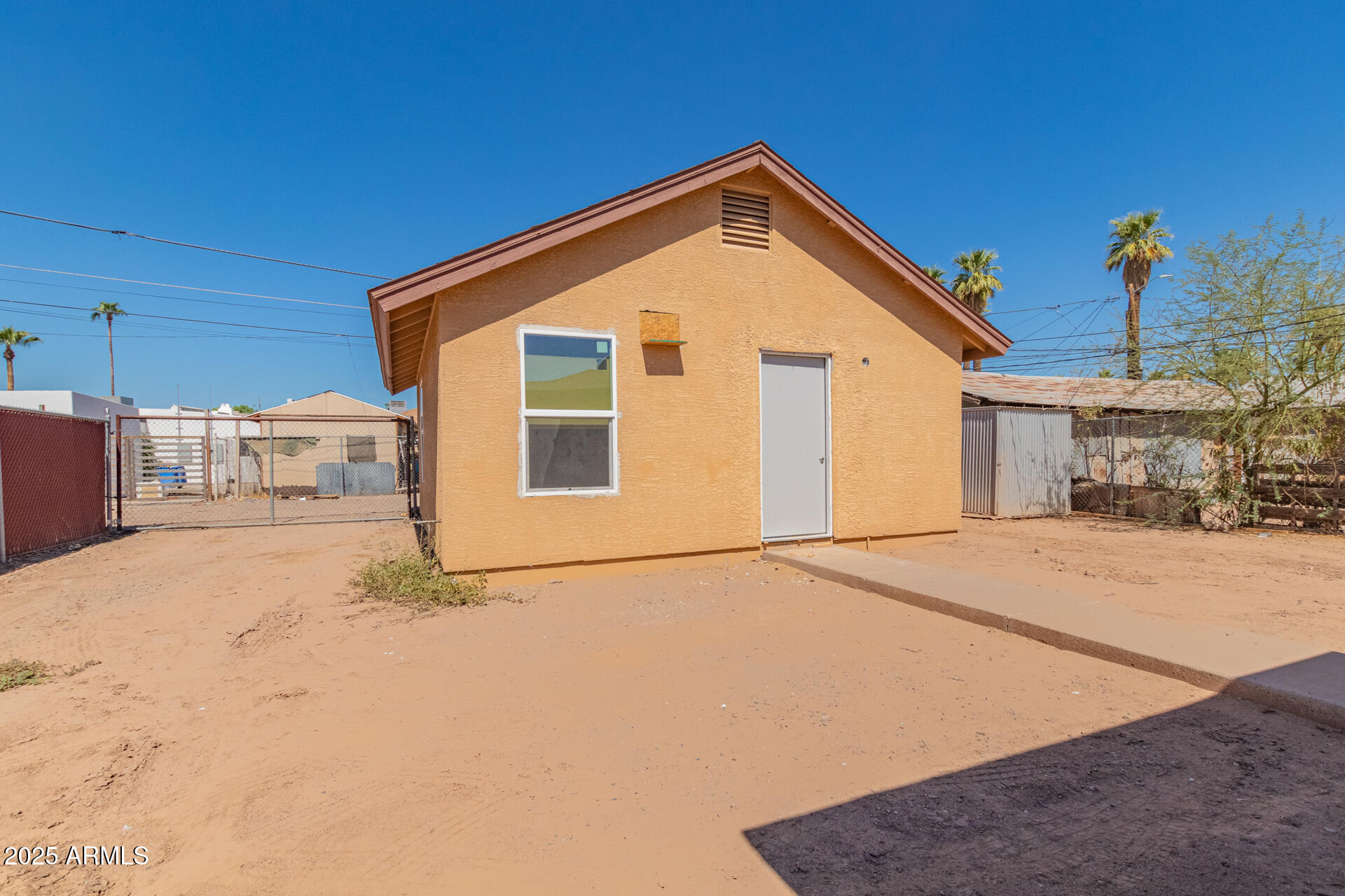 2118 West Adams Street Phoenix, AZ 85009 - Photo 26 of 48 a front view of a house with a yard